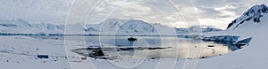 Wiencke Island / Dorian Bay landscape with snowy mountains in Antarctica.