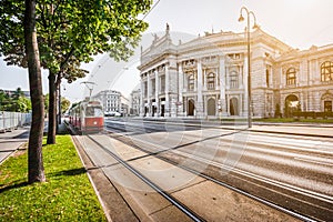 Wiener Ringstrasse with Burgtheater and tram at sunrise, Vienna, Austria