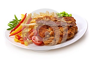 Wiener schnitzel with potatoes fries, isolated on white background