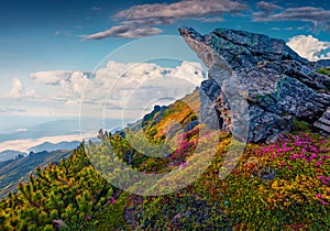 Wierd shape of big boulder on the edge of cliff in Carpathian mountains.