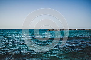 Wiev of Mediterranian sea. Blue water and rocks.