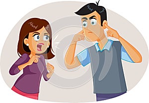 Wife Arguing with Husband While He Covers His Ears