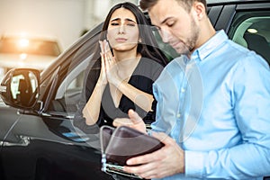 Wife begs her husband to buy new car