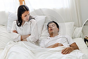 Wife can`t sleep Because the husband snores loudly on bedroom in morning.