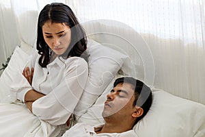 Wife can`t sleep Because the husband snores loudly on bedroom in morning.