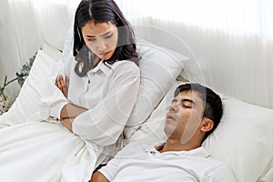 Wife can`t sleep Because the husband snores loudly on bedroom in morning.