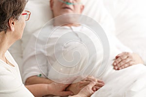 Wife caring about dying spouse