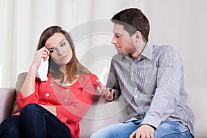 Wife crying by her husband