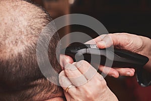 Wife cutting husbands hair at home