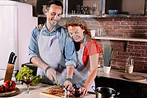 Wife and husband cooking together