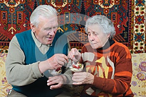 Wife and husband eat dessert