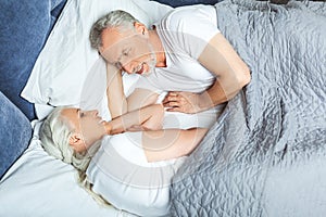 Wife and husband lying in the bed