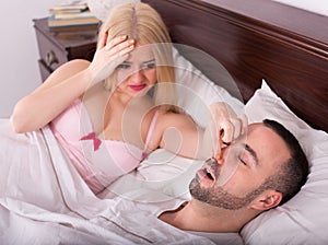 Wife and husband snoring in sleep
