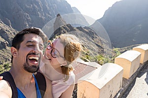 Wife and husband taking a selfie, smiling on a trip in their Honeymoon at Masca, Tenerife.