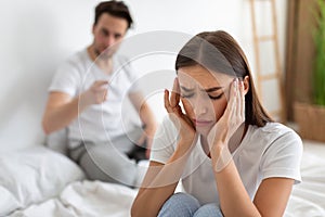 Wife Listening To Husband& x27;s Accusations Having Quarrel Sitting In Bedroom