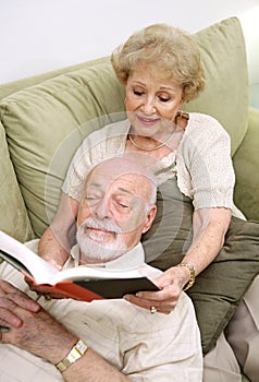 Wife Reading to Husband