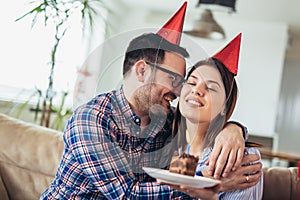 Wife surprise his husband with birthday cake .Anniversary