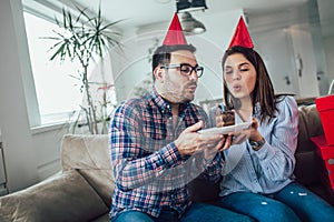 Wife surprise his husband with birthday cake .Anniversary