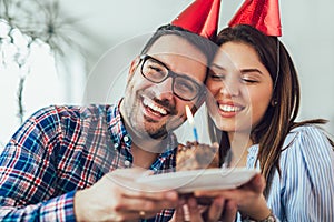 Wife surprise his husband with birthday cake.Anniversary