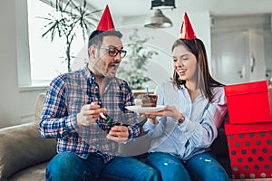 Wife surprise his husband with birthday cake.Anniversary