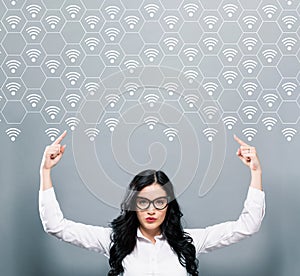 WiFi concept with business woman pointing upwards