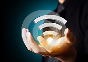 Wifi social network technology symbol in businessman hand