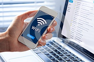 WiFi symbol, smartphone screen, button to connect to wireless internet photo