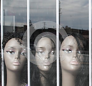 Wig Mannequins in a Window