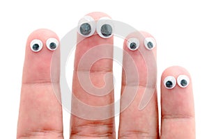 Wiggle eyes stuck on fingers photo