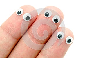 Wiggle eyes stuck on fingers photo