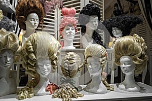 Wigs on mannequin heads in a shop