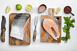 Wild Alaskan Sockeye or Coho Salmon fillet, on white stone table background, top view flat lay