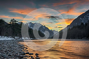 Wild alpine river lech at sunset