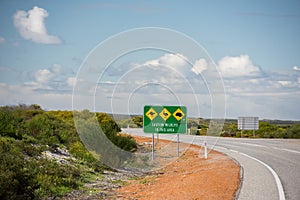 Wild animals sign on West Australia Desert endless road