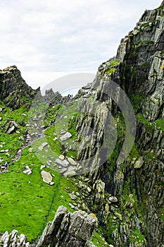 Wild Atlantic Way: Adventurous climbers are part of spectacular jagged horizon above `Christ`s Valley,`high on Skellig Michael. photo