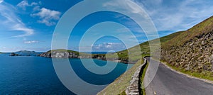 Wild Atlantic Way coastal road leads to Slea Head on Dingle Peninsula in County Kerry of western Ireland photo