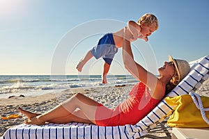 Wild, barefoot and free. a single mother spending the day at the beach with her little boy.