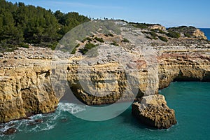 Wild beach nature landscape with turquoise water in Benagil Algarve, Portugal