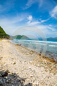 Wild beach without people next to Sanya bay, Hainan, China