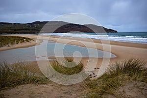 wild beach protected by its natural ecohabitat., Killahoey Strand near Dunfanaghy, Donegal, Ireland. wild atlantic way photo
