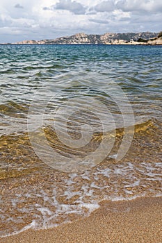 Sea coast of Italy with clear azure blue water and sandy wild beach photo