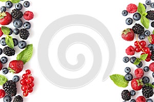 wild berries and mint leaves on a white background top view.