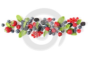 wild berries and mint leaves on a white background top view.