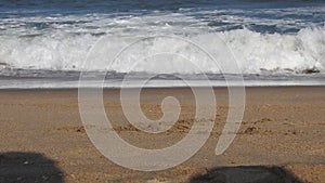 Wild big island beach. Blue turquoise sea and white sand background. Beautiful vacation blue turquoise sea water. Sea waves rollin