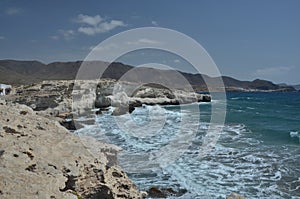 Wild sea with rocky coast in Almeria, Andalucia, Spain photo