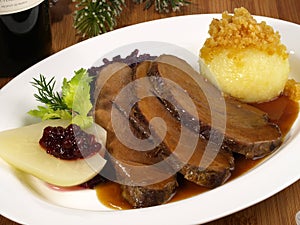 Wild Boar Roast with Potato Dumpling and red Cabbage