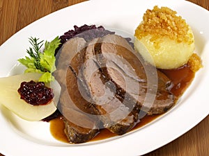 Wild Boar Roast with Potato Dumpling and red Cabbage