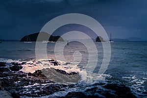 Wild breakers splashing on the rocks on a stormy day