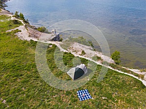Wild camping with a tent on the shore of the Baltic Sea in Paldiski in summer