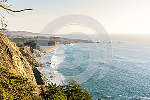 Wild coastline in central Califora lit by a setting sun in fall